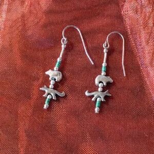 Hand-beaded double totem silver and turquoise drop earrings on ear wires.